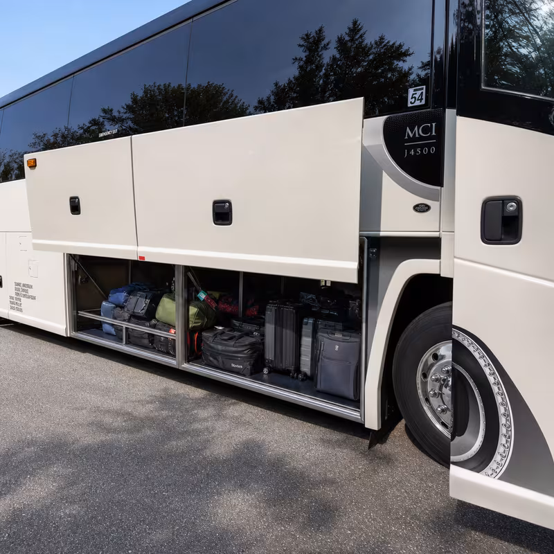 Party bus interior with wraparound leather seating and LED lighting in Miami