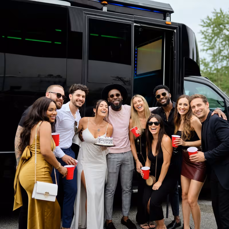 Party bus interior with wraparound leather seating and LED lighting in Miami