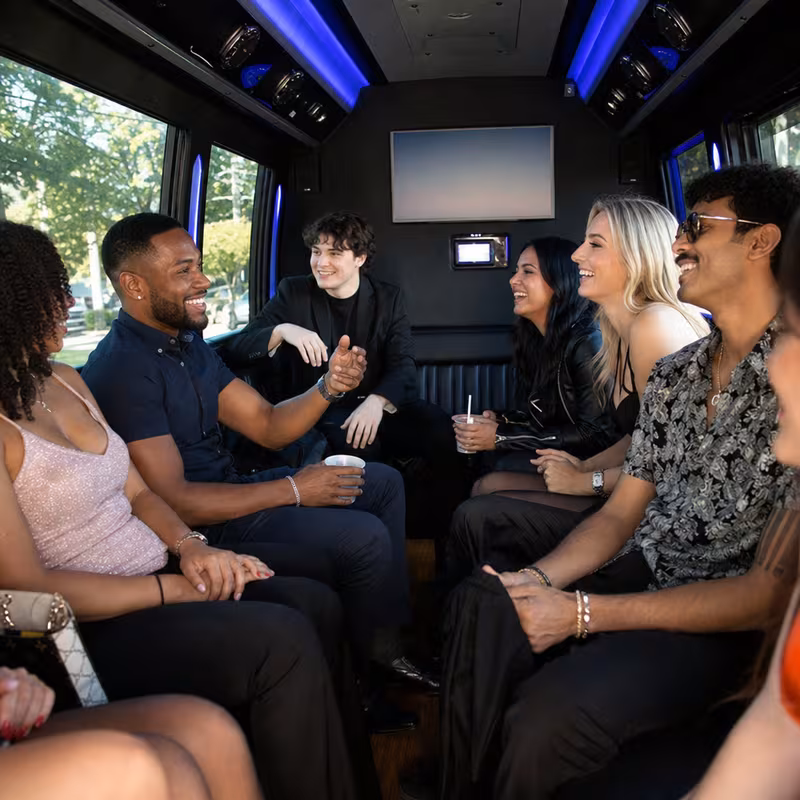 Passengers loading luggage while boarding an Miami group shuttle