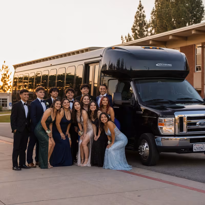 Group boarding a white charter bus for Prom & Homecoming Transportation transportation in Miami