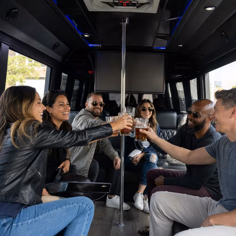 Group boarding a white charter bus for Winery & Brewery Tour Transportation transportation in Miami
